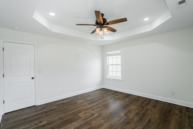 111 Arthur St, Dalton, GA 30721 - empty room featuring a tray ceiling, dark wood-type flooring, a ceiling fan, baseboards, and recessed lighting