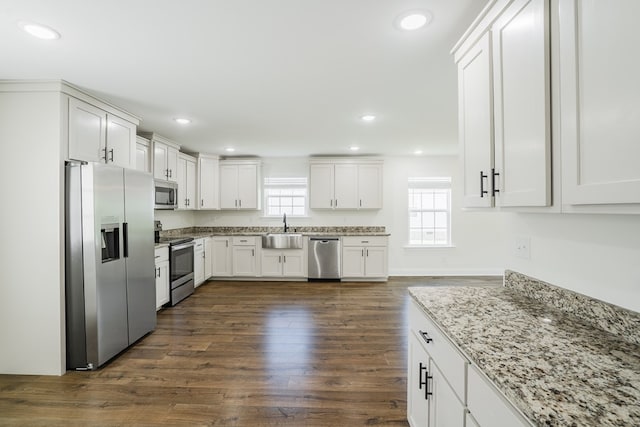 111 Arthur St, Dalton, GA 30721 - kitchen with stainless steel appliances, a sink, white cabinetry, dark wood-style flooring, and recessed lighting