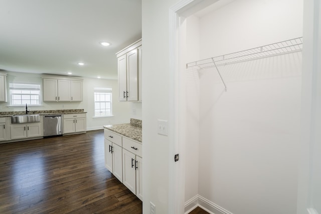 111 Arthur St, Dalton, GA 30721 - kitchen with stainless steel dishwasher, a sink, dark wood-style floors, baseboards, and recessed lighting