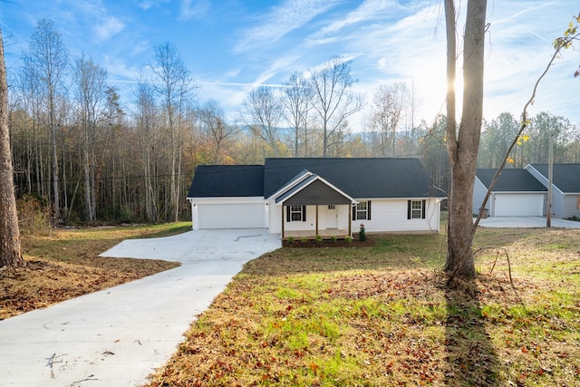 single story home featuring a garage, a front yard, and a porch