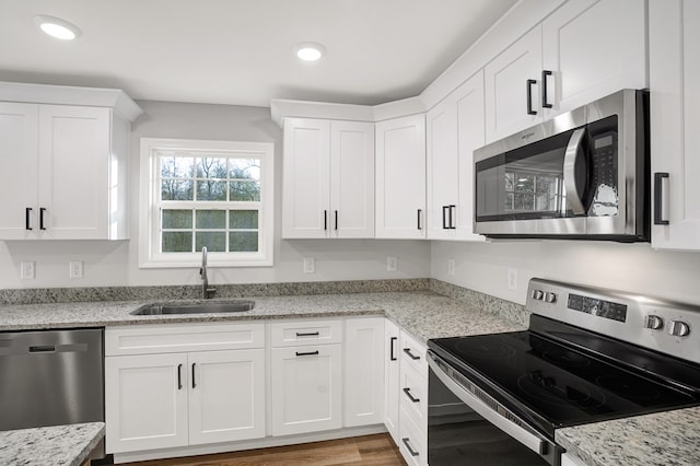 kitchen featuring white cabinetry, sink, and stainless steel appliances