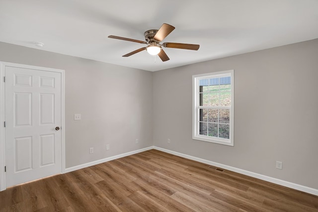 unfurnished room featuring ceiling fan and wood-type flooring