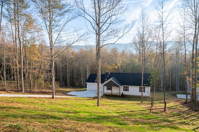 view of front of house with a garage and a front yard