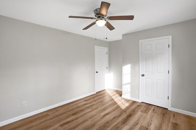 unfurnished bedroom featuring ceiling fan and light hardwood / wood-style floors