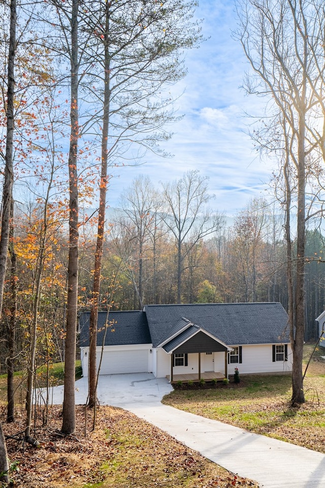 view of front of property with a garage and a front yard