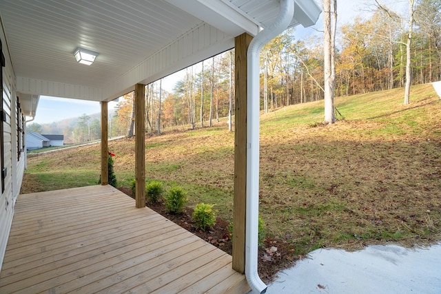 deck featuring a lawn