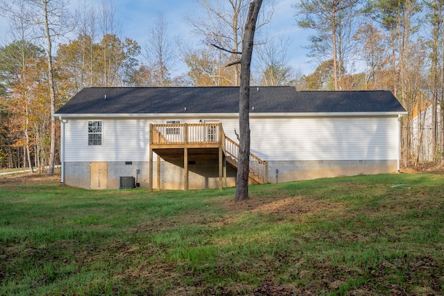 back of property featuring a yard and a deck