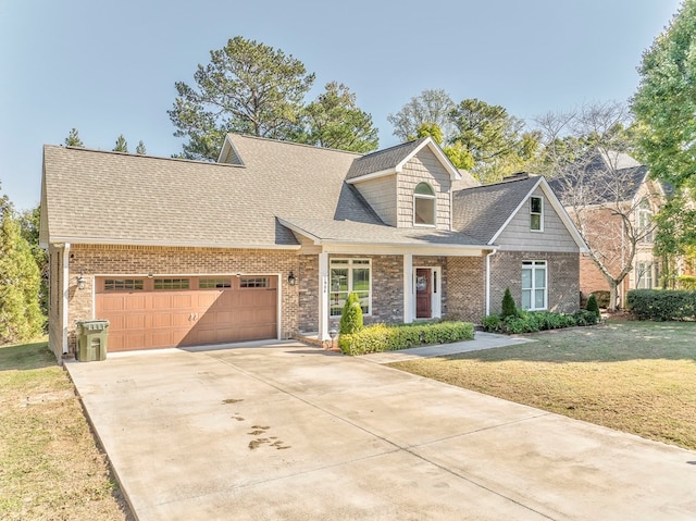 cape cod home featuring a garage, a front yard, and covered porch