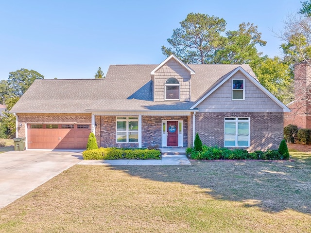 view of front of house with a garage and a front lawn