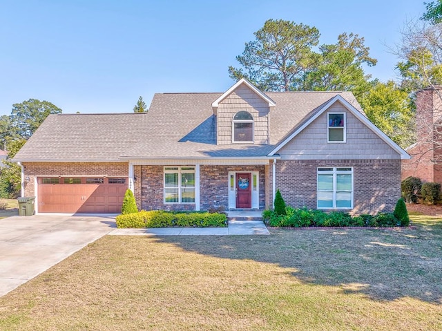 view of front of house with a garage and a front lawn