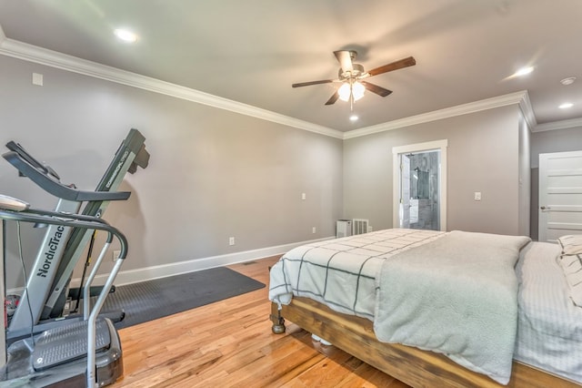 bedroom featuring wood-type flooring, ornamental molding, and ceiling fan