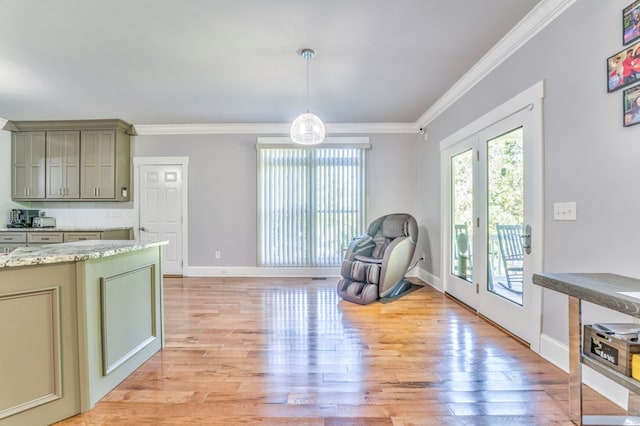 interior space with crown molding, light hardwood / wood-style flooring, and french doors