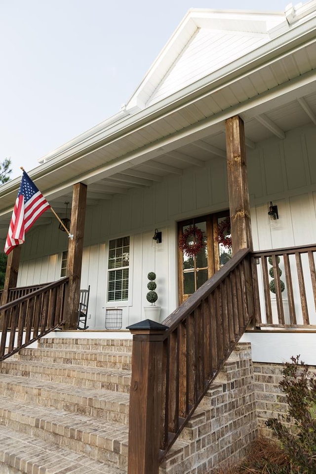 view of exterior entry with covered porch