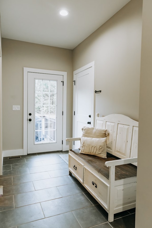 mudroom featuring tile patterned floors, visible vents, and recessed lighting