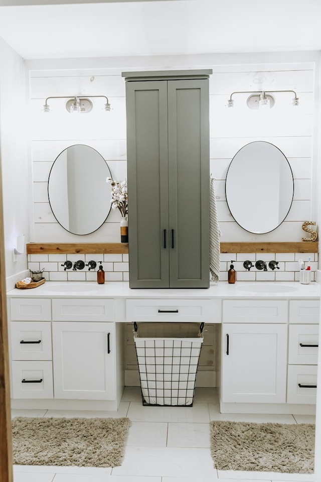 bathroom featuring tile patterned floors, decorative backsplash, and vanity