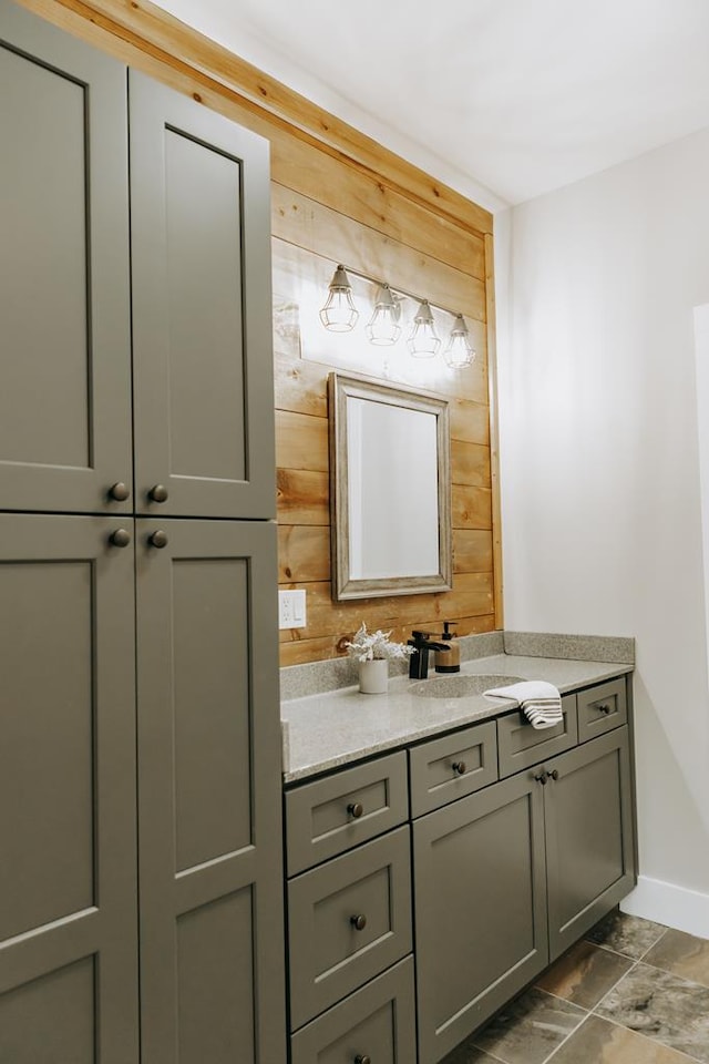 bathroom featuring baseboards and vanity