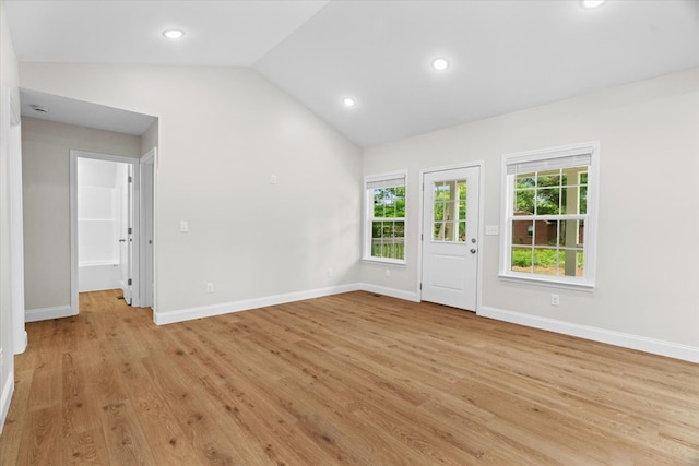 500 Woodland Dr, Dalton, GA 30721 - unfurnished living room with vaulted ceiling, light wood finished floors, and recessed lighting