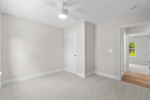 500 Woodland Dr, Dalton, GA 30721 - unfurnished bedroom featuring light carpet and a ceiling fan