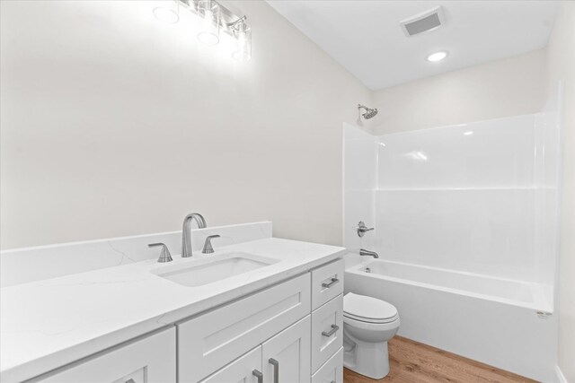 500 Woodland Dr, Dalton, GA 30721 - bathroom featuring wood finished floors, shower / washtub combination, and vanity