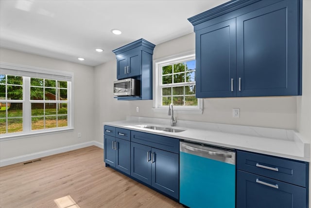 500 Woodland Dr, Dalton, GA 30721 - kitchen with dishwasher, blue cabinetry, light wood-style flooring, stainless steel microwave, and recessed lighting