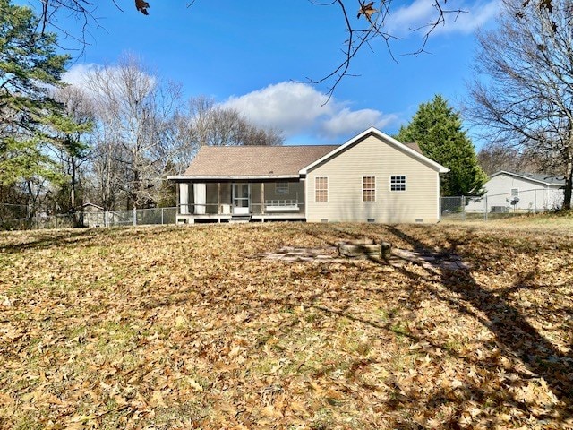 back of house with a sunroom