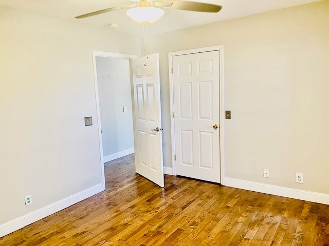 interior space with hardwood / wood-style flooring and ceiling fan