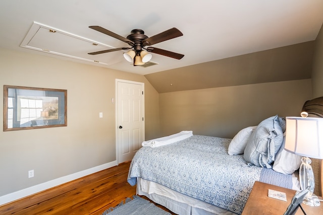 bedroom with wood-type flooring, vaulted ceiling, and ceiling fan