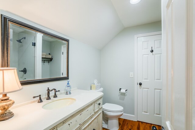 816 Dogwood Ln, Dalton, GA 30720 - full bath with vaulted ceiling, a shower, wood finished floors, toilet, and vanity