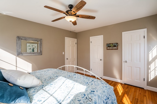 bedroom featuring ceiling fan and wood-type flooring