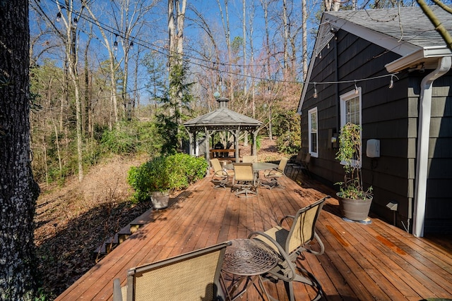 wooden terrace featuring a gazebo