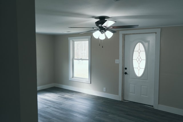 foyer featuring a ceiling fan, wood finished floors, and baseboards