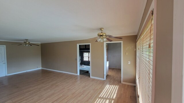 2517 Utility Rd, Rocky Face, GA 30740 - spare room with a ceiling fan, ornamental molding, light wood-style floors, and baseboards