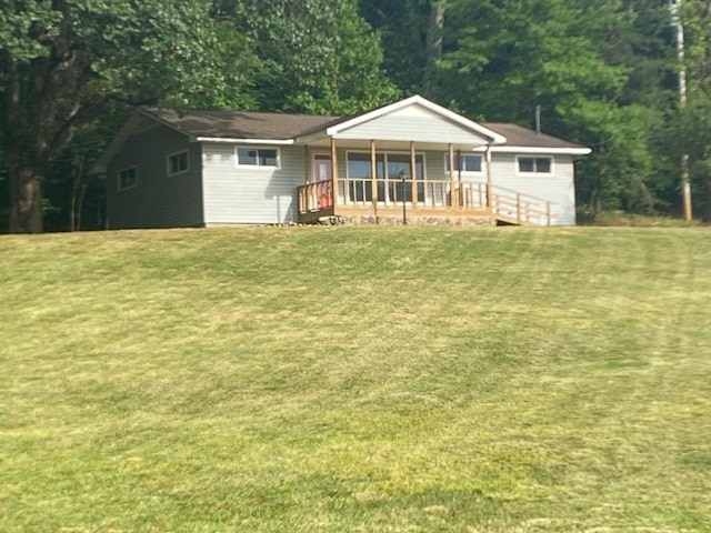 2517 Utility Rd, Rocky Face, GA 30740 - back of property with covered porch, a yard, and a forest view