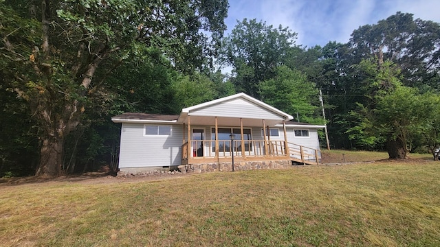 2517 Utility Rd, Rocky Face, GA 30740 - view of front facade with covered porch, a front yard, and crawl space