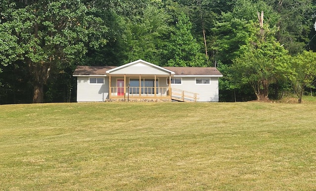 ranch-style house with a porch and a front yard