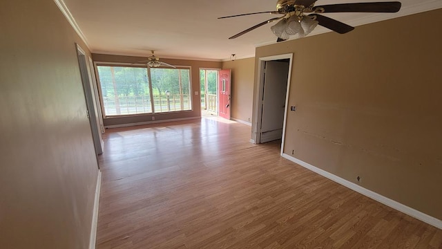 2517 Utility Rd, Rocky Face, GA 30740 - spare room with crown molding, ceiling fan, light wood-style floors, and baseboards