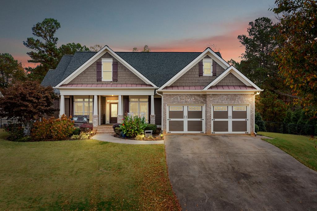 craftsman-style house featuring a yard and covered porch