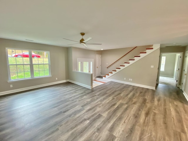 empty room featuring ceiling fan and light wood-type flooring