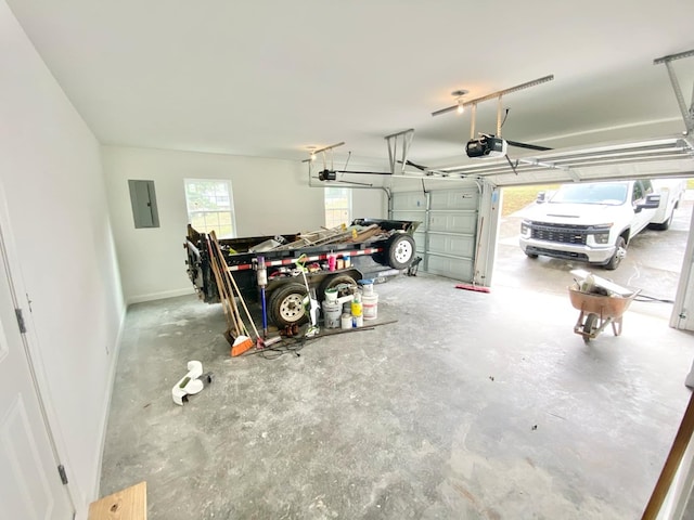 garage featuring a garage door opener and electric panel