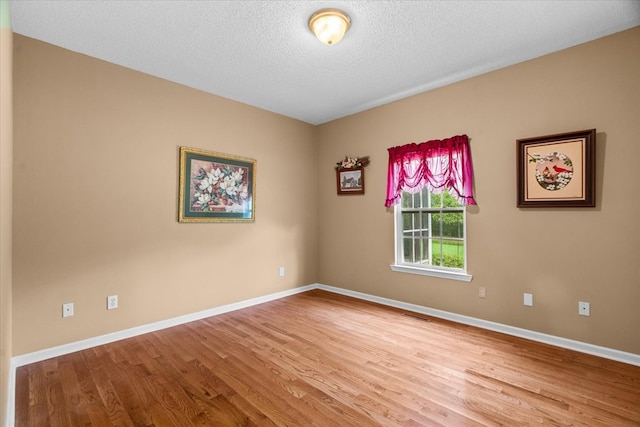 188 Valley Rd, Chatsworth, GA 30705 - spare room featuring wood finished floors and a textured ceiling