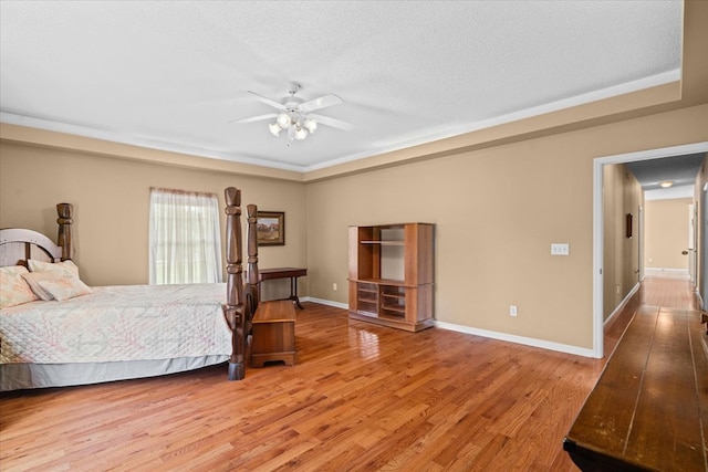 188 Valley Rd, Chatsworth, GA 30705 - bedroom featuring light wood-style floors, a textured ceiling, and a ceiling fan