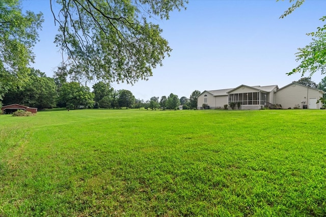 188 Valley Rd, Chatsworth, GA 30705 - view of green lawn with a sunroom