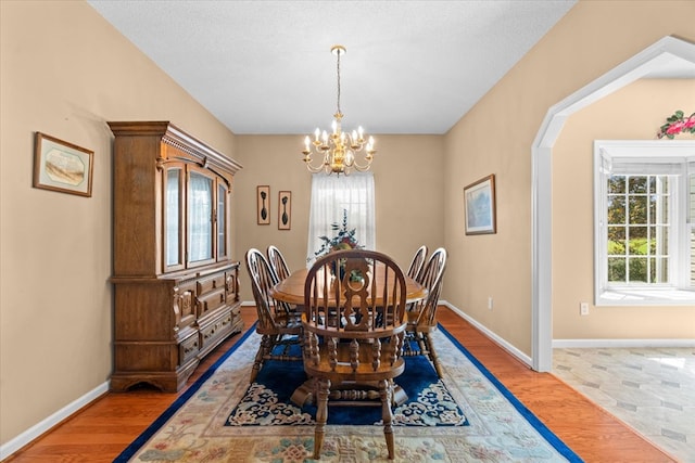 188 Valley Rd, Chatsworth, GA 30705 - dining space with a chandelier, healthy amount of natural light, and light wood-style floors