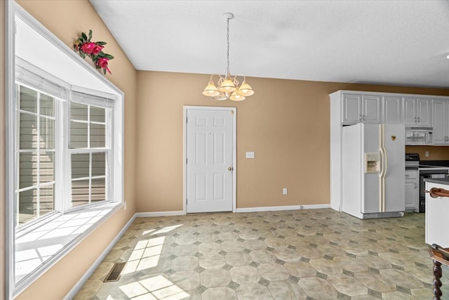 188 Valley Rd, Chatsworth, GA 30705 - kitchen with white appliances, a chandelier, pendant lighting, and a textured ceiling