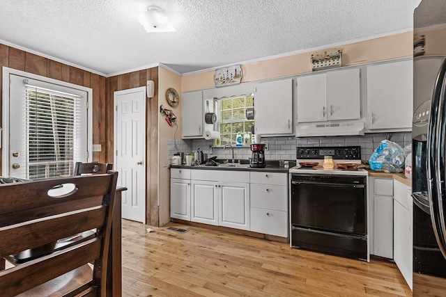 kitchen with white cabinetry, range with electric cooktop, ornamental molding, and light hardwood / wood-style flooring