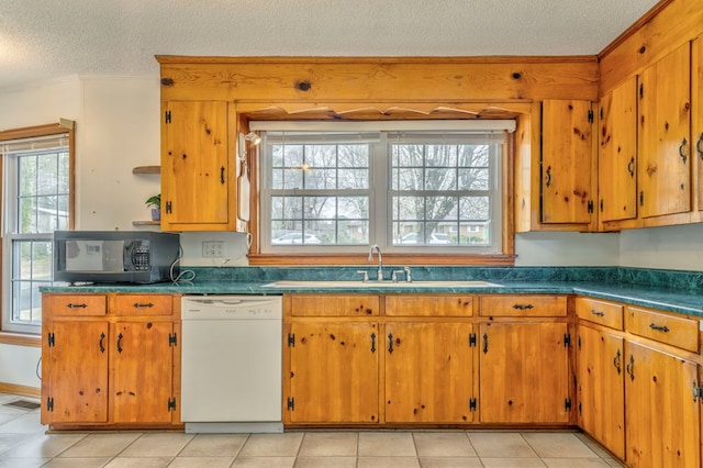 kitchen featuring ornamental molding, a sink, a textured ceiling, black microwave, and white dishwasher