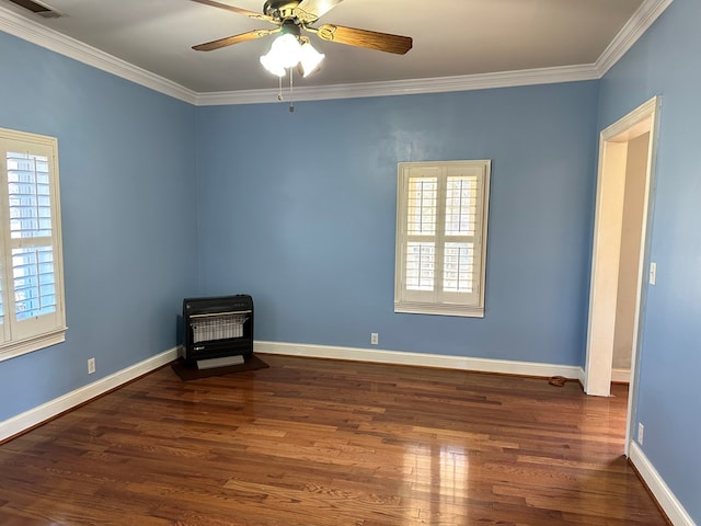 spare room featuring dark hardwood / wood-style flooring, crown molding, and ceiling fan