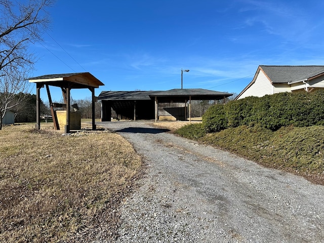 view of outbuilding with a carport