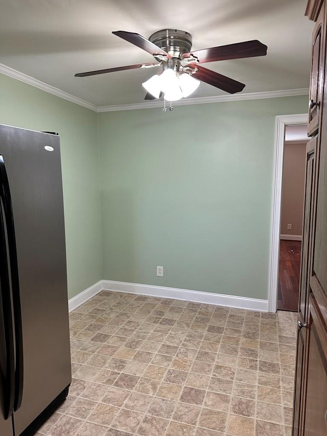 kitchen featuring crown molding, ceiling fan, and stainless steel fridge