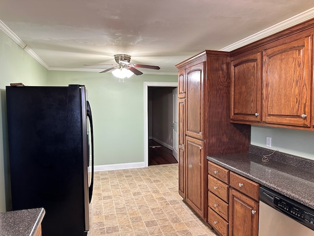 kitchen featuring stainless steel appliances, ornamental molding, ceiling fan, and dark stone counters